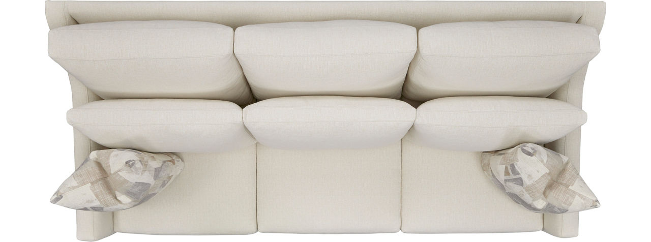 Three-seat sofa with seat cushions and pillows.