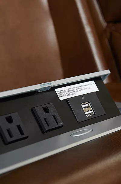 Detail of the Aviator loveseat console featuring power strip