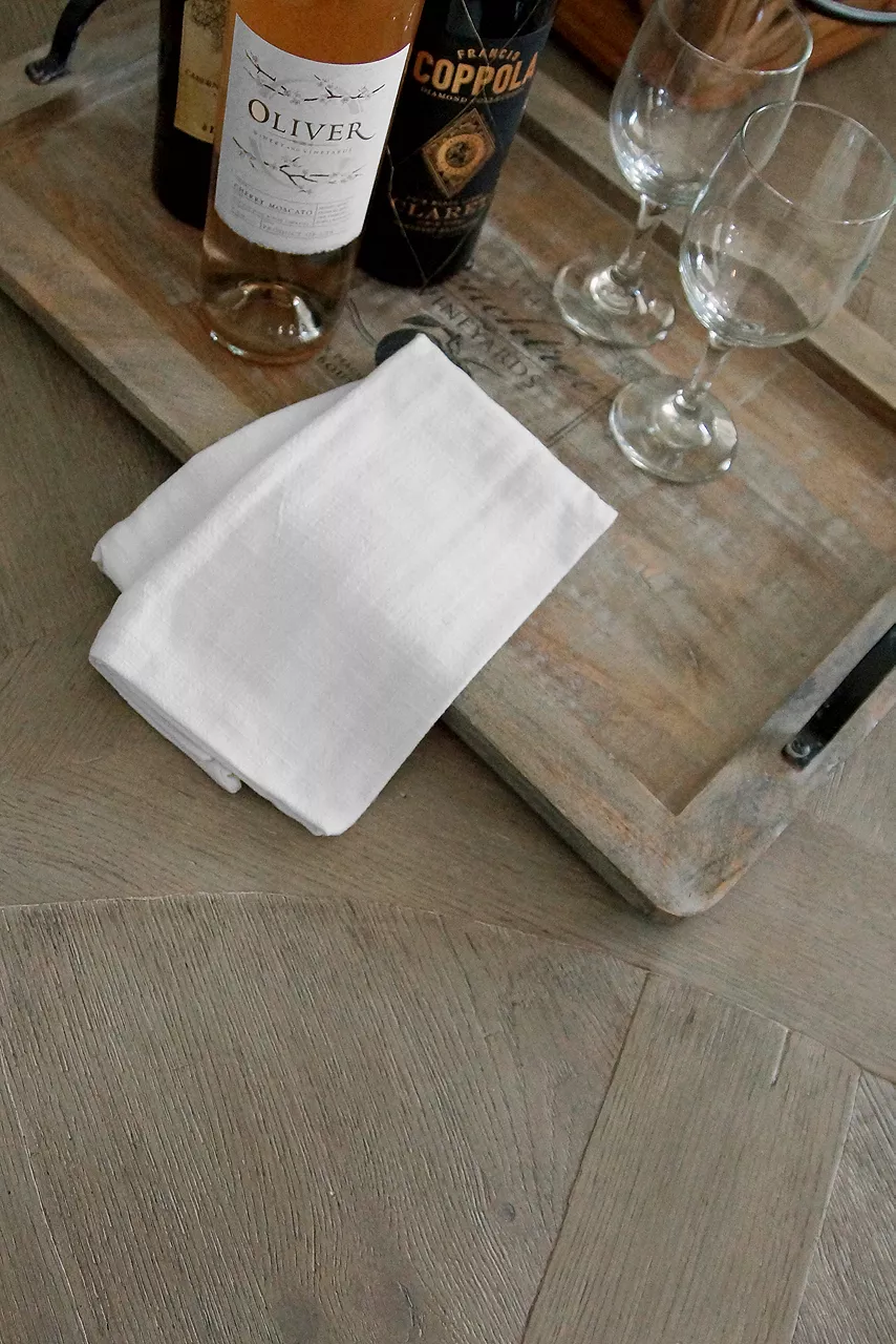Shot of table with wine glasses and bottles of wine