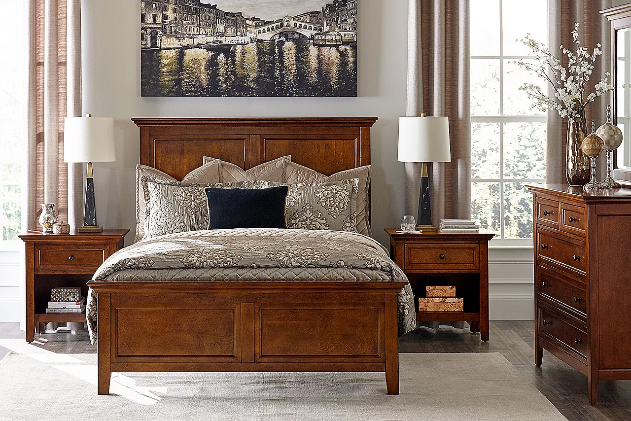 Ashebrooke bed, nightstands, and chest with mirror in a room scene.