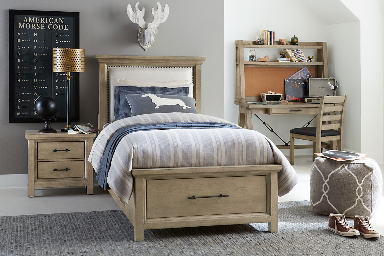 Grayson upholstered youth bed, nightstand, desk with hutch, and desk chair in a room scene.