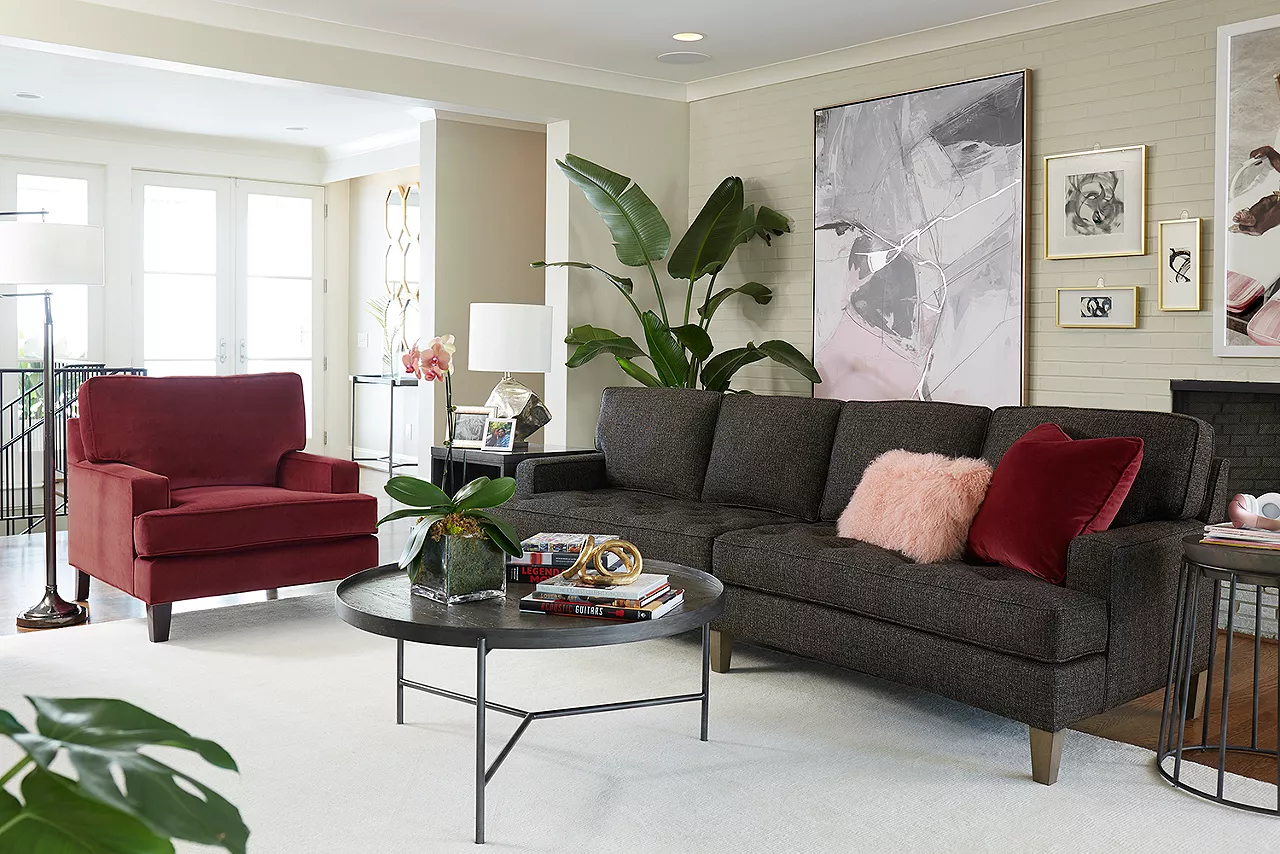 Gianna Conversation Sofa in Bermuda Espresso, Erin Matching Chair in customized velvet red, and a Kori Round Coffee Table in a room scene.