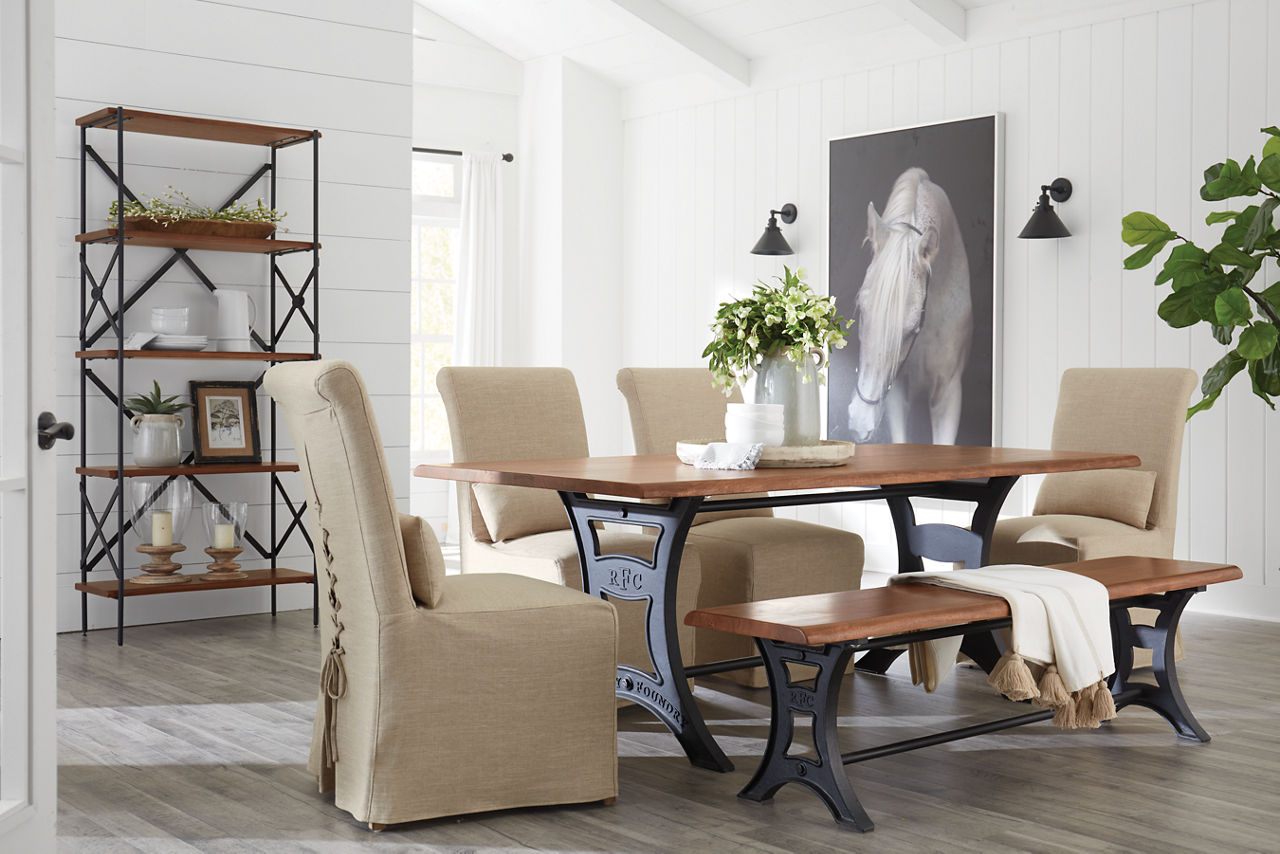 River City Dining Table Bench, and Etagere in Walnut and Mariah Parsons Chairs in Alexander Linen in a room scene.
