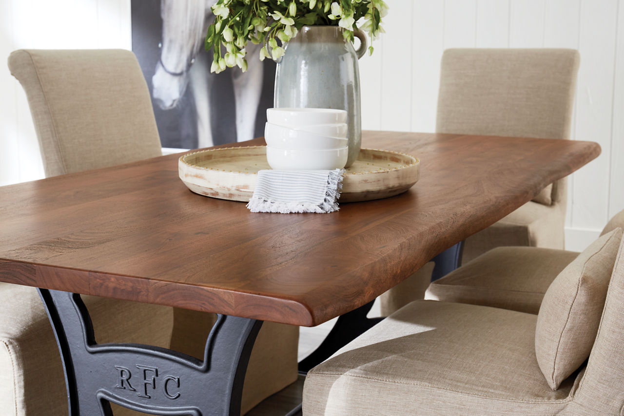 River City Dining Table in Walnut and Mariah Parsons Chairs in Alexander Linen in a room scene.