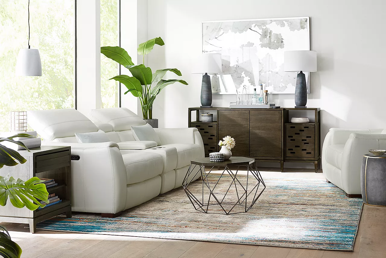 Leo Sofa and Recliner in Optical White. The sofas headsets are raised in a room scene.