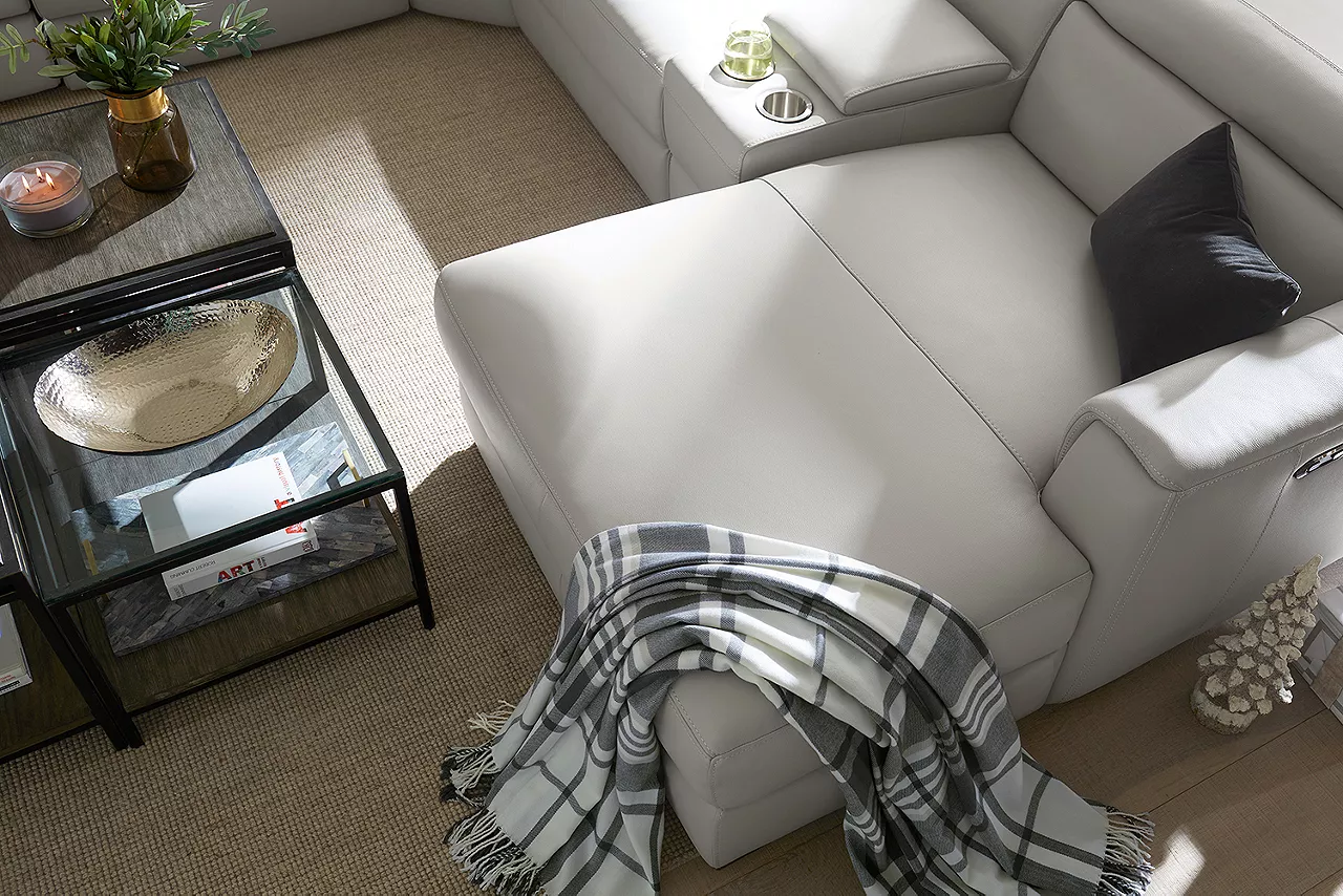 Leo Sectional in Dove Gray and Keaton Bunching Coffee Table in a Christmas room scene.