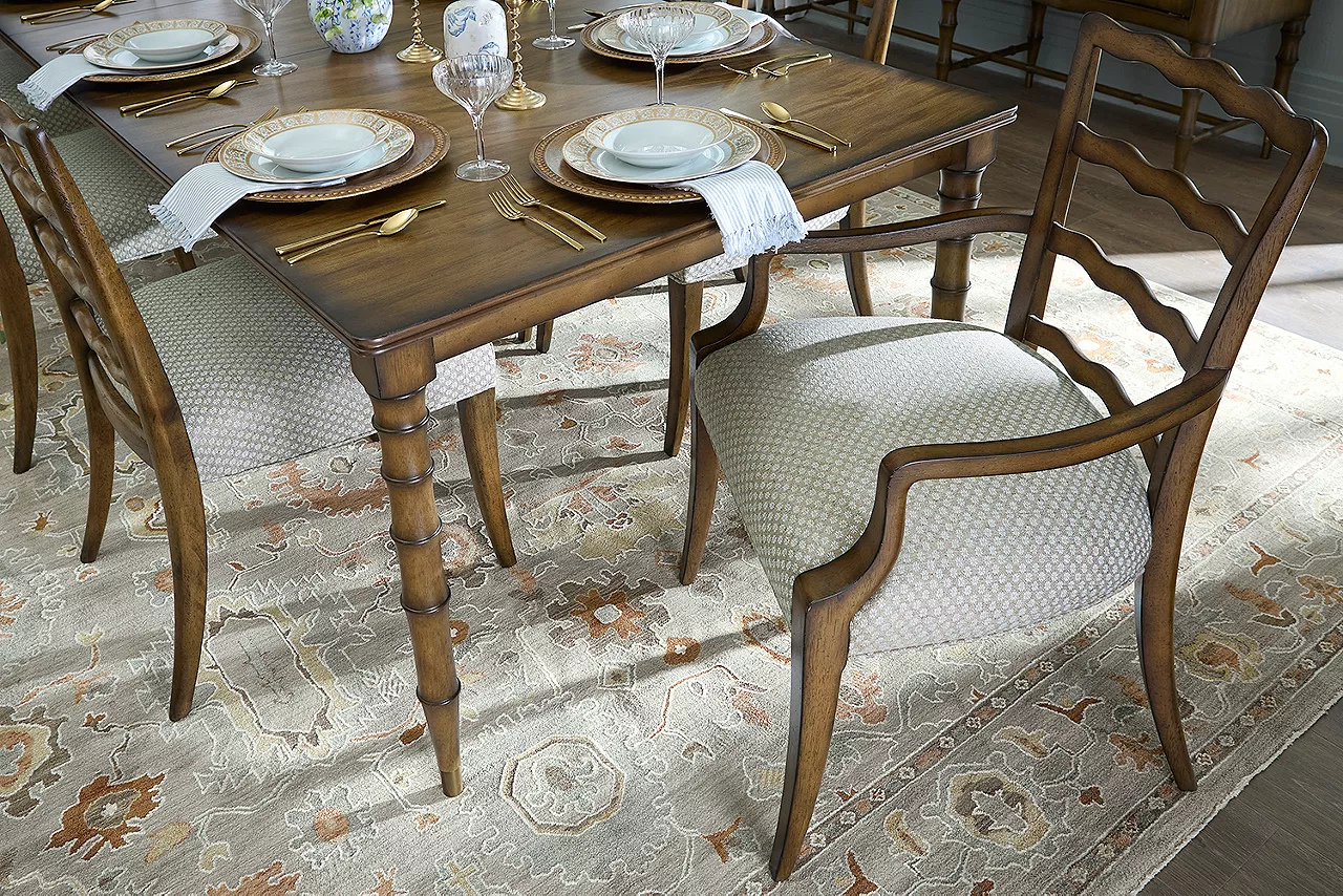 Detail of the Madeline dining table and armchair in a room scene