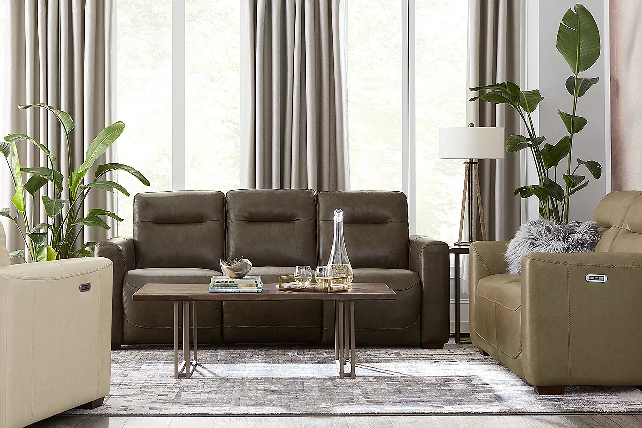 Melbourne Dual Power Sofa in Grey, Recliner in Ice and one in Taupe and Kori Bunching Coffee Table in Pine and Cork in a room scene.