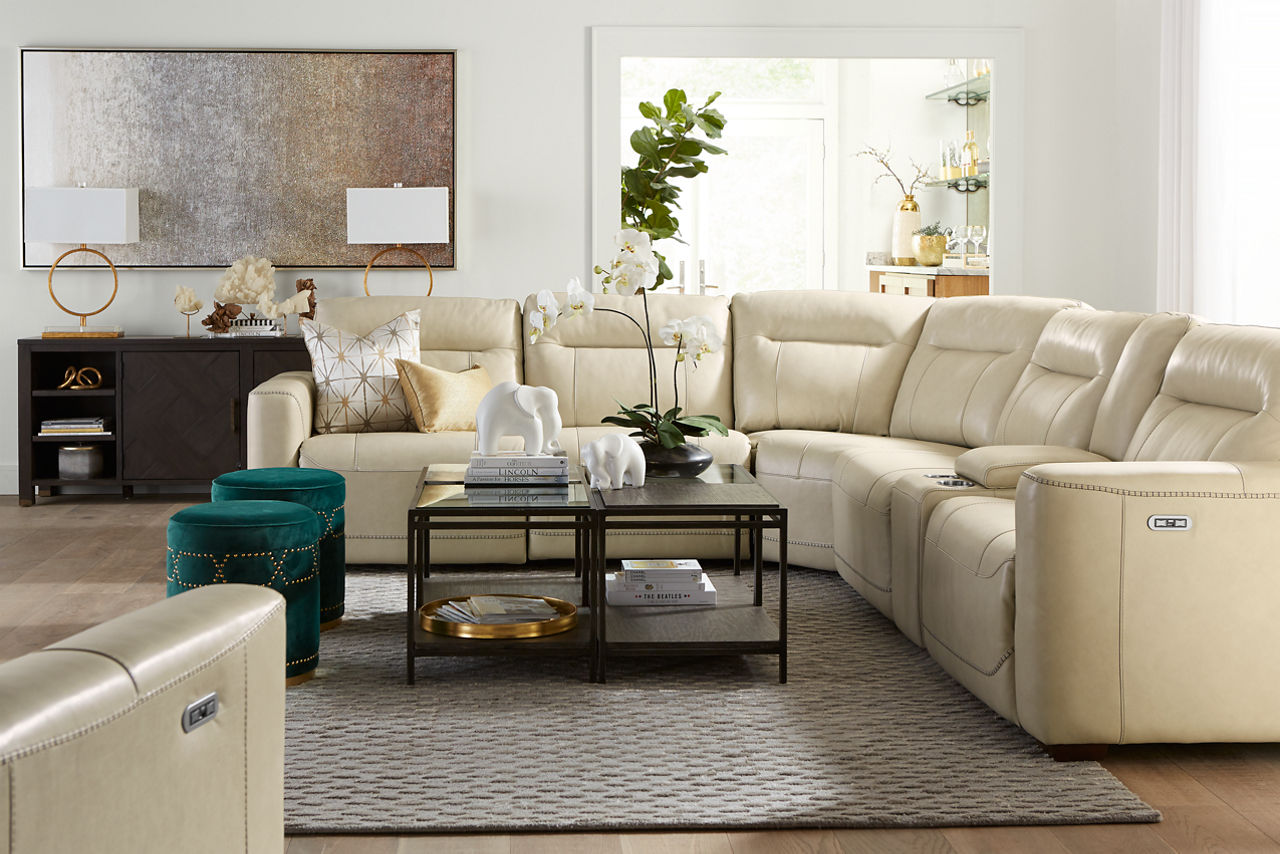 Melbourne Sectional and Recliner in Ice and Keathon Bunching tables in Wood, Glass and Vellum top in a room scene.