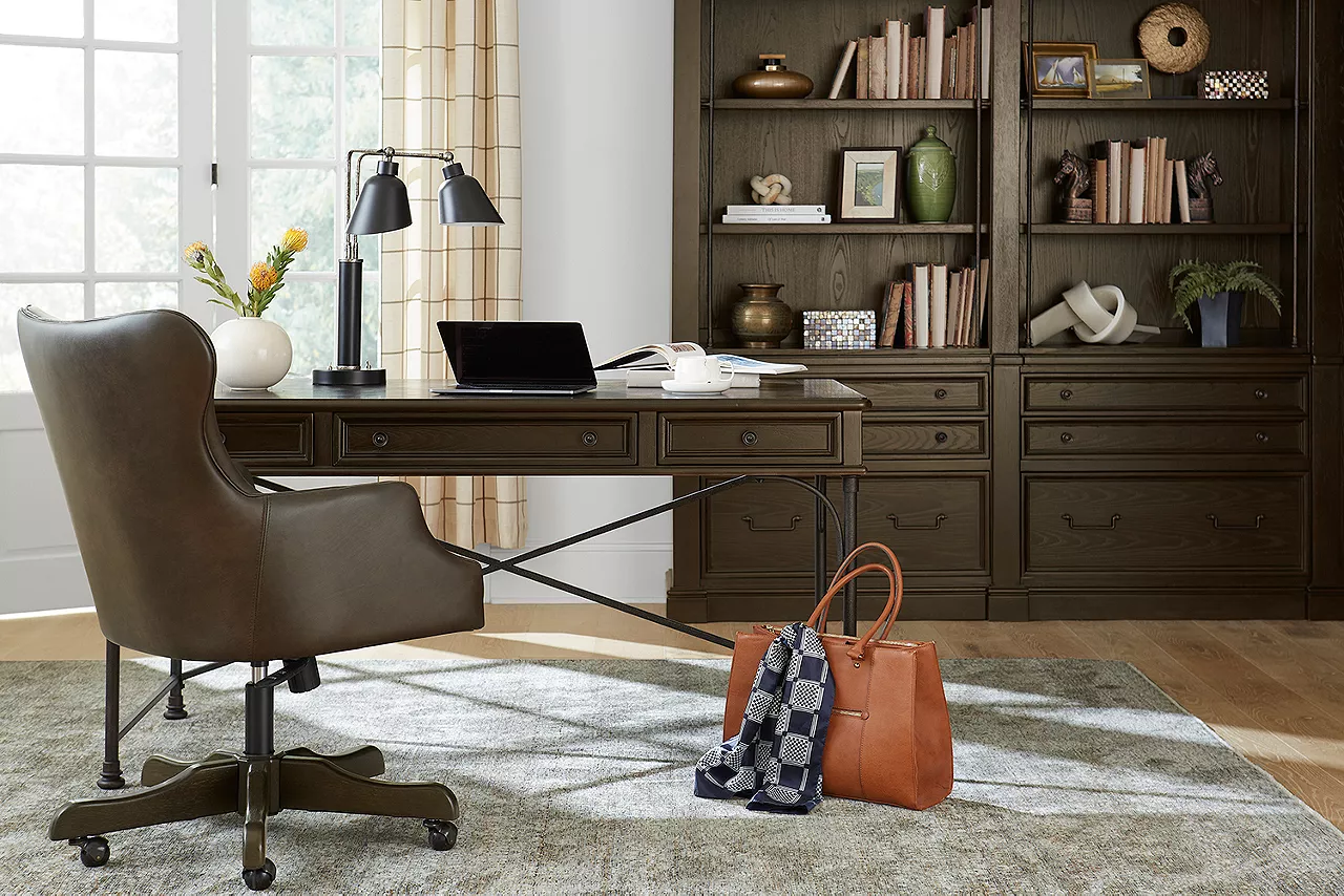 Barnes writing desk, desk chair and bookcase wall in a room scene