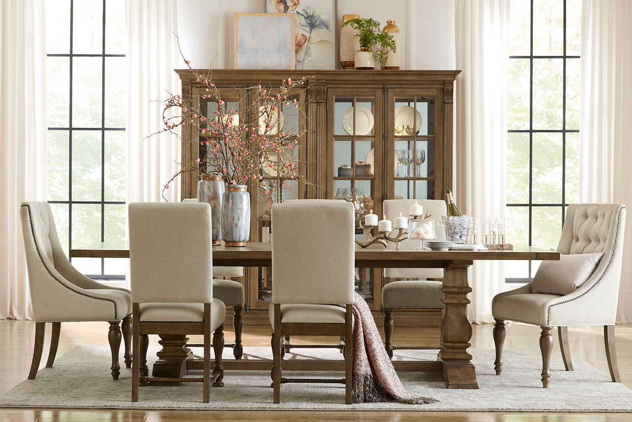 Avondale II Display Cabinets, Dining Table, Dining Chairs, and Tufted Dining Chairs in Vintage Oak in a room scene.
