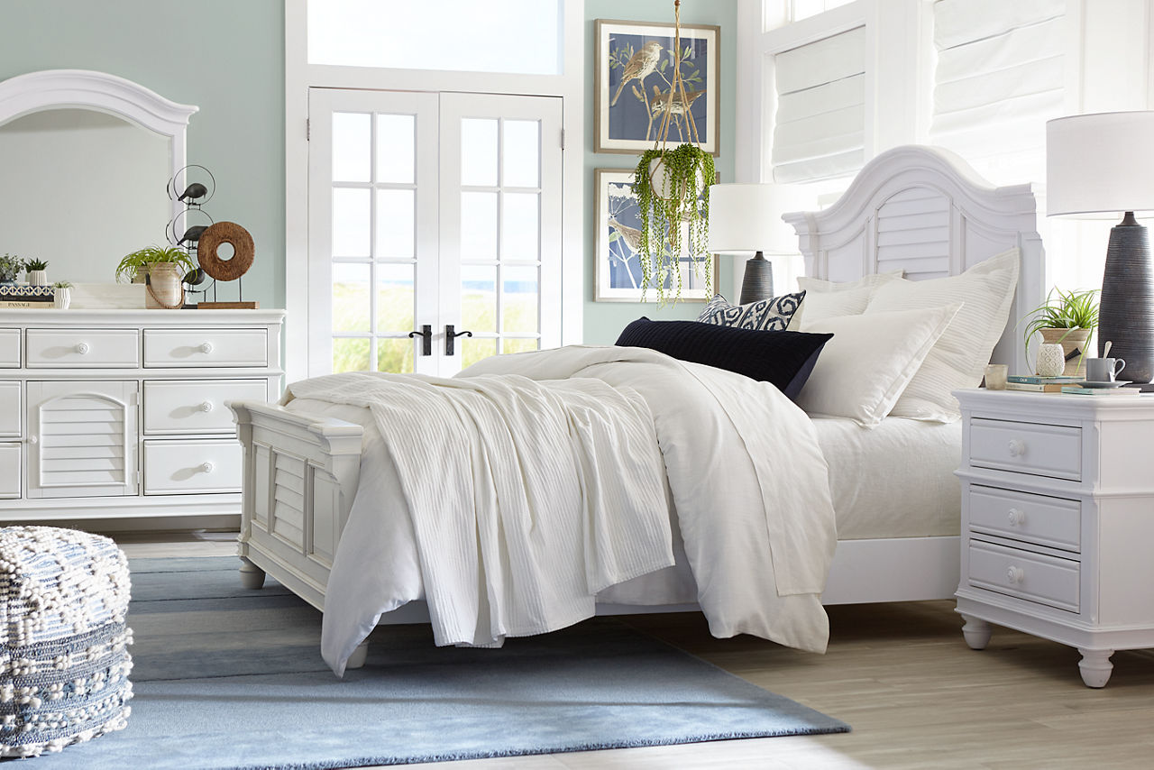 Coastal Retreat Bed, Nightstand, and Dresser with Mirror in a room scene.