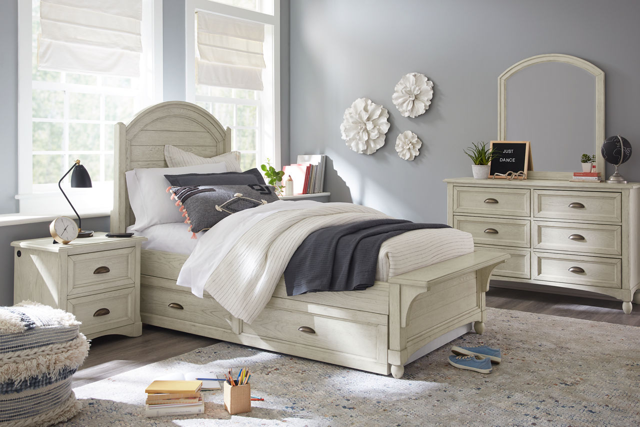 Riley youth bench bed and trundle with nightstand and dresser with mirror in room scene.
