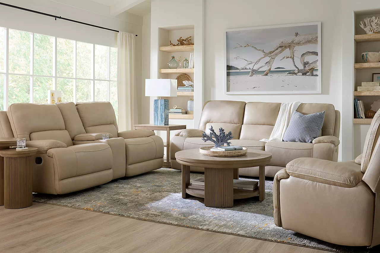 Haven reclining sofa, loveseat with console and recliner in Softee Ivory with the Wynn tables
