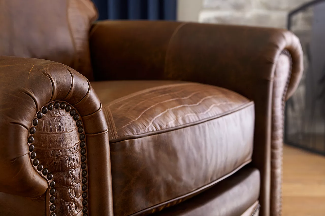 Dakota Recliner in American Bison Walnut- Tooled. Closeup to show the details and texture of the leather in a room scene.