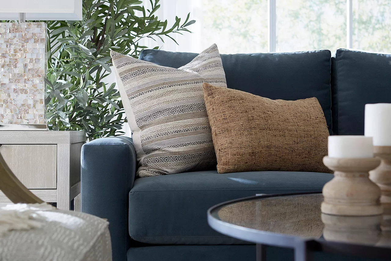 Kilim and Nessa pillows on a custom Destinations sofa in a room scene