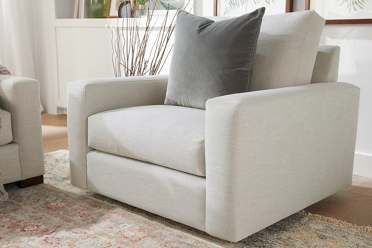 Destinations Swivel Chair in Convert Ivory in a room scene.