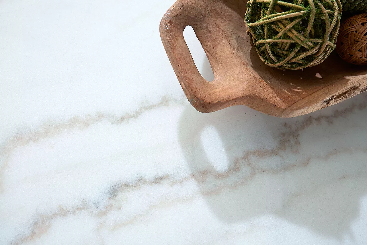 Emory Coffee Table. Closeup of the marble top of the table showing the detail in a room scene.