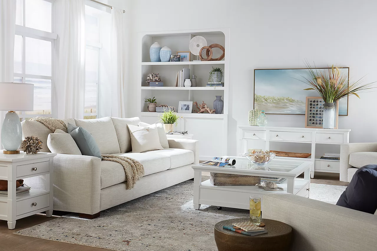 Destinations 3-Seat Sofa and Swivel Chairs in Convert Ivory in a room scene.