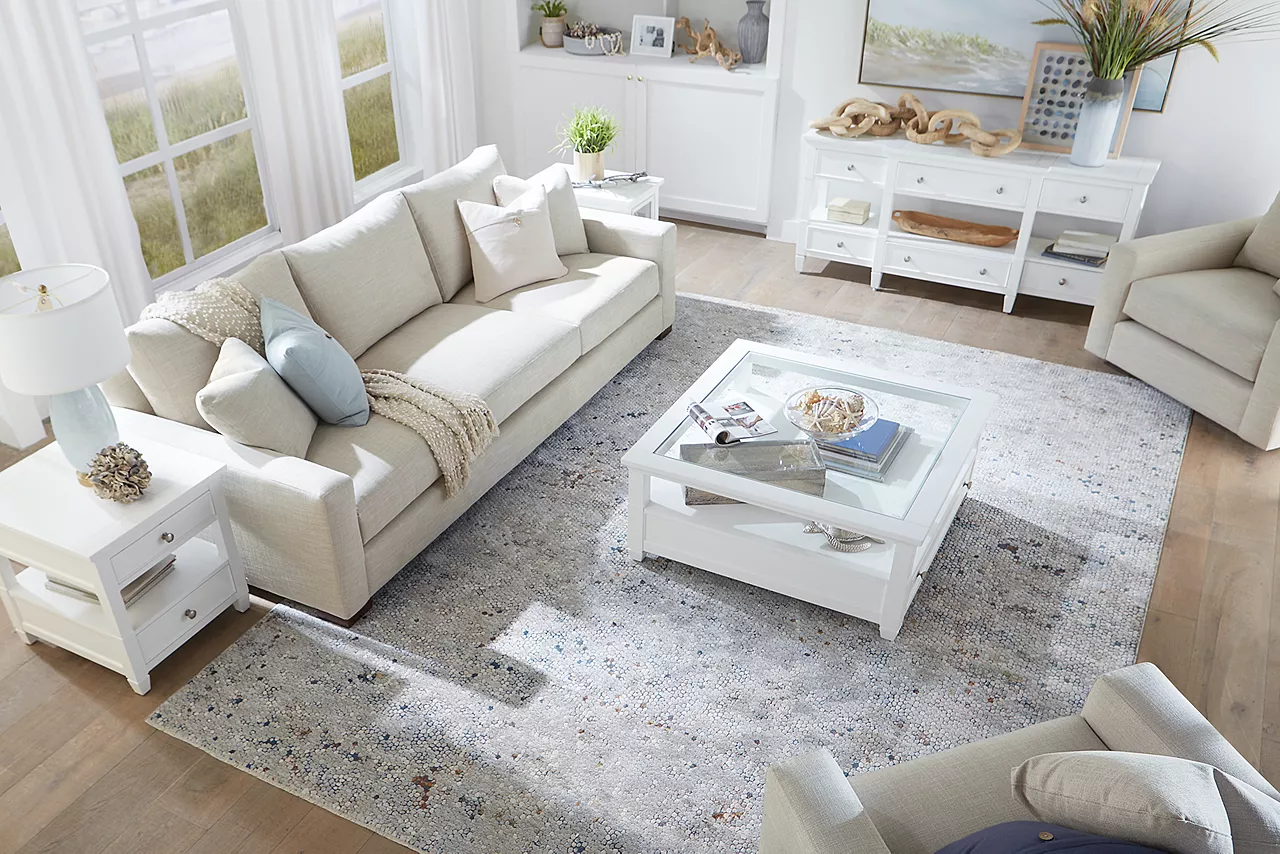 Destinations 3-Seat Sofa and Swivel Chairs in Convert Ivory in an overhead view of a room scene.
