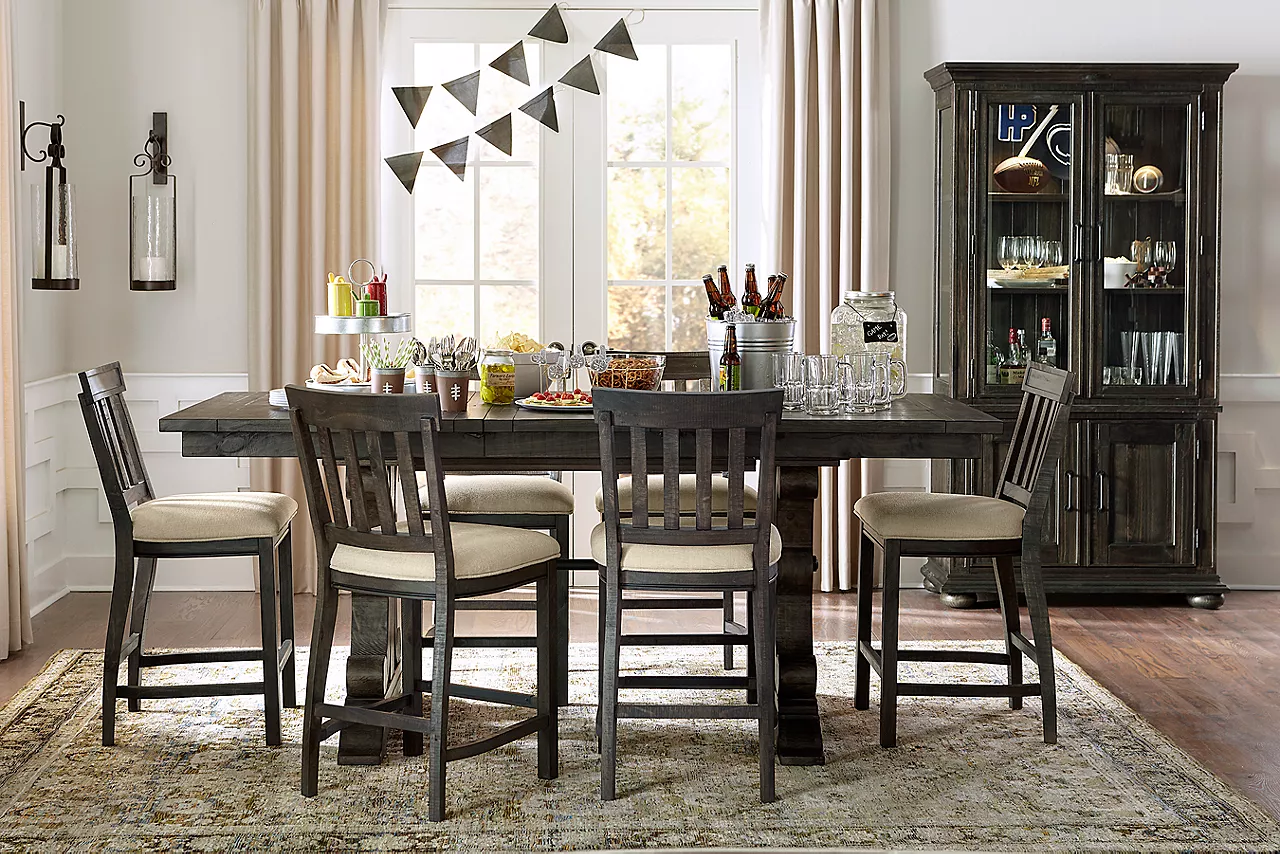 Blue Ridge Counter-Height Table, Stools, and China Cabinet in Weathered Charcoal in a Football Season room scene.