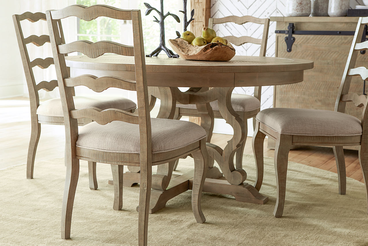 Blue Ridge Round Dining Table, Ladder Back Chairs, and Buffet in Dovetail Grey in a room scene.