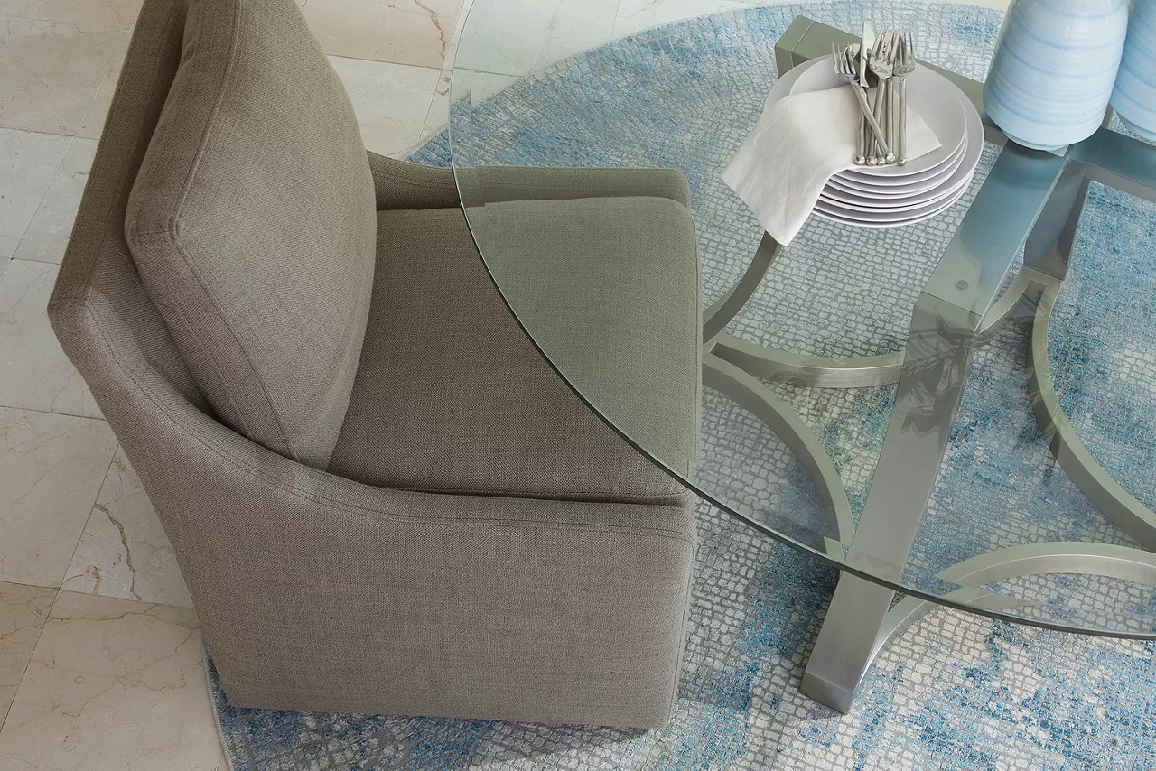 Detail of the Curved Base Landry dining table with Nolan dining chair in Smoke 