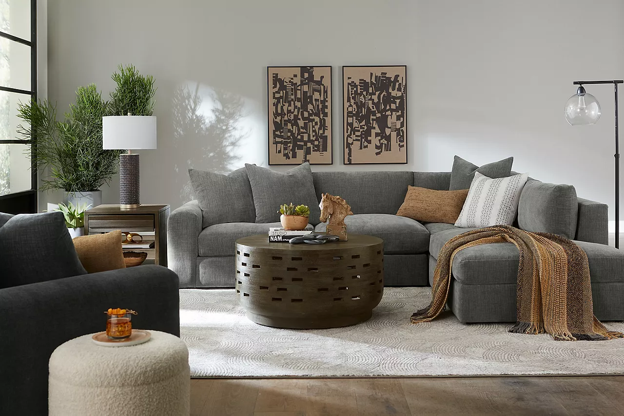 Logan sectional and swivel chair in room scene
