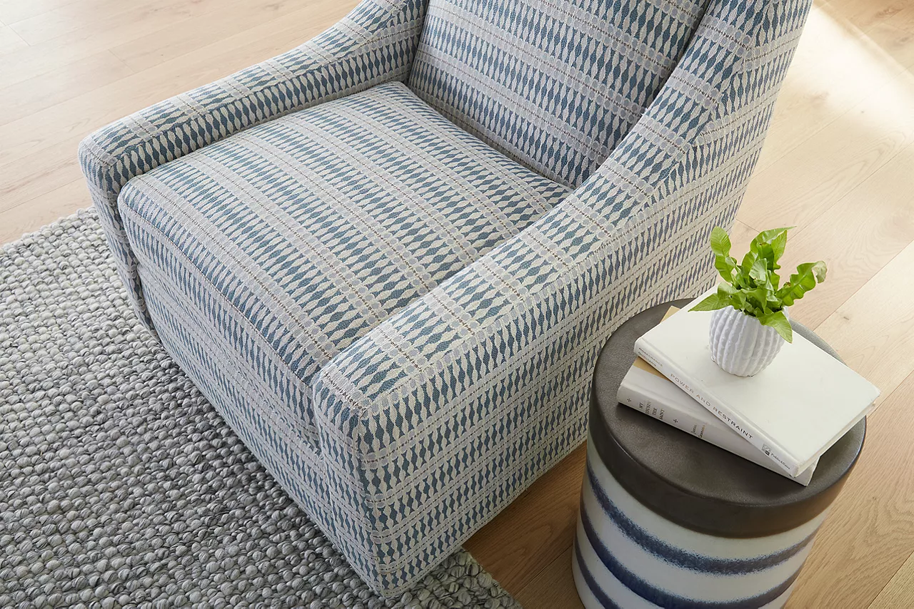 Gigi Swivel Chair in Fine China Wedgewood Blue showing detail of the fabric pattern in a room scene.