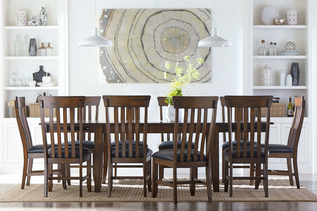 Chapman Dining Table and Dining Chairs in Rustic Whiskey in a room scene.