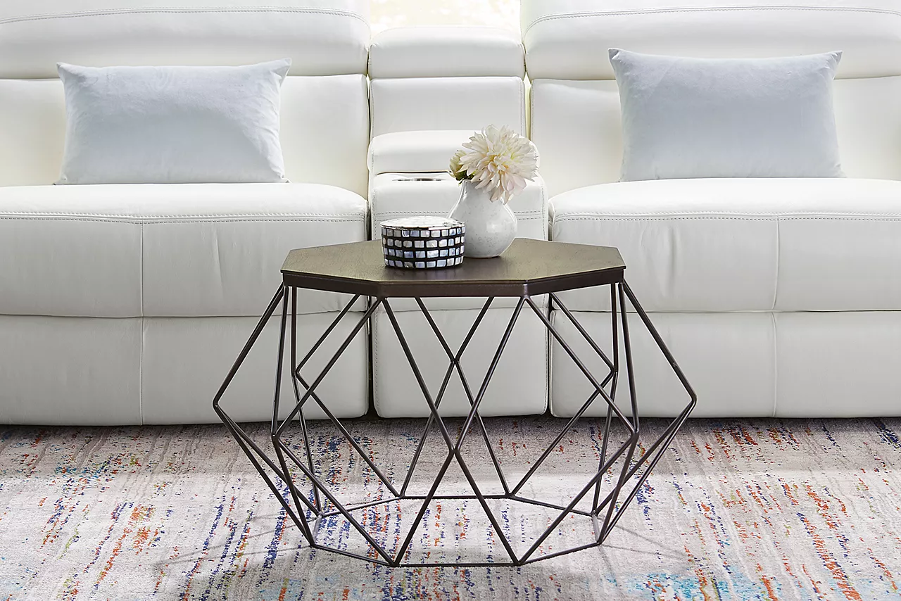The Roscoe metal base coffee table and a Leo sofa in a room scene.