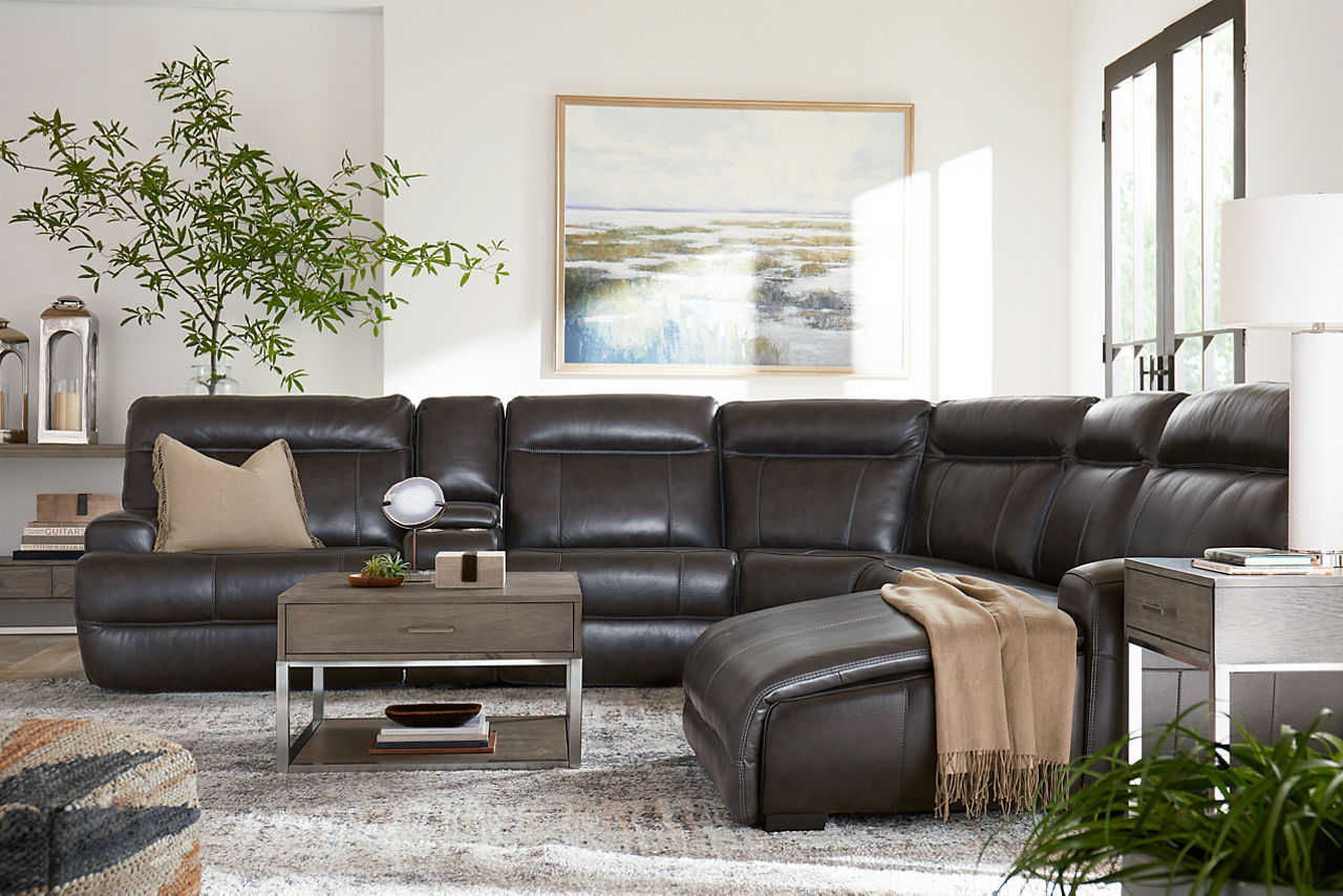 Regis Sectional in Pewter and Sidney square coffee, end, and sofa tables in a room scene.