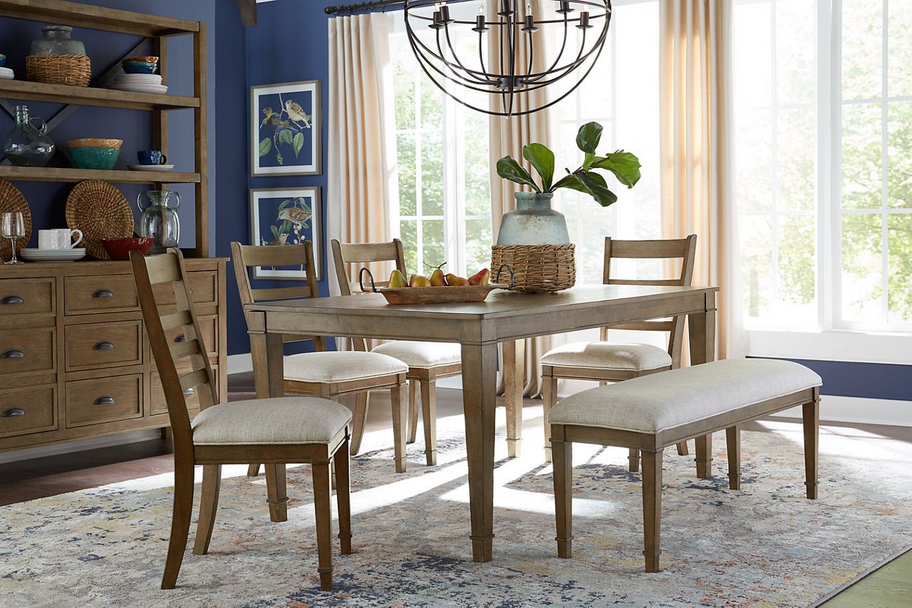 Oakmont Dining Table, Ladder Back Chairs, Dining Bench, and Sideboard in Red Oak in a room scene.