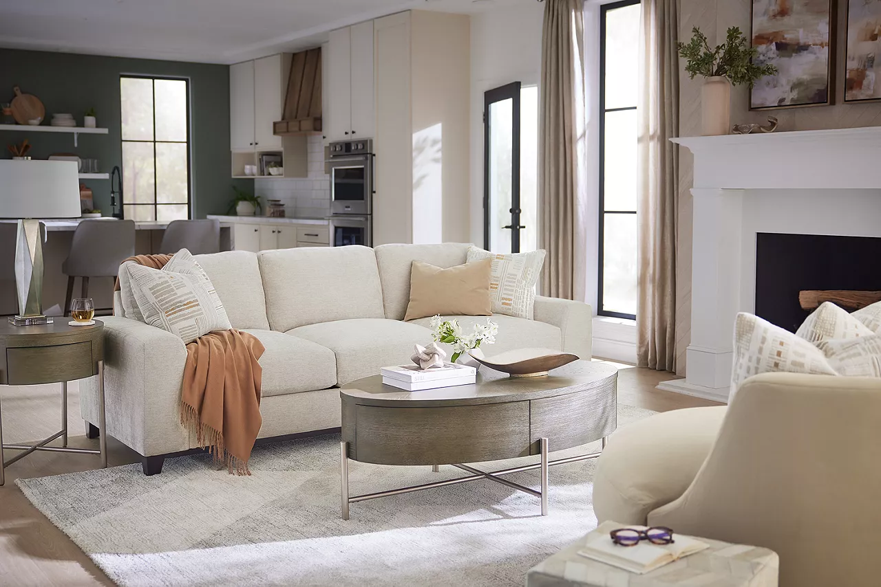 Harmony 97 Inch Sofa and swivel chair with Brixton coffee table in a room scene