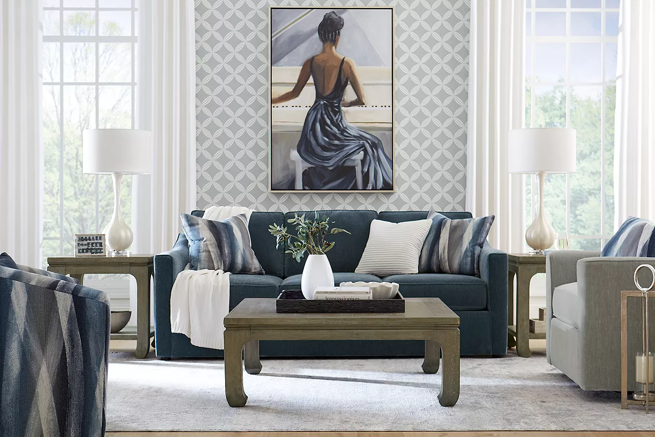 Shiloh sofa in Contessa Shadow, swivel chair in Contessa Dove, and a swivel accent chair in Zain Dusk in a room scene.