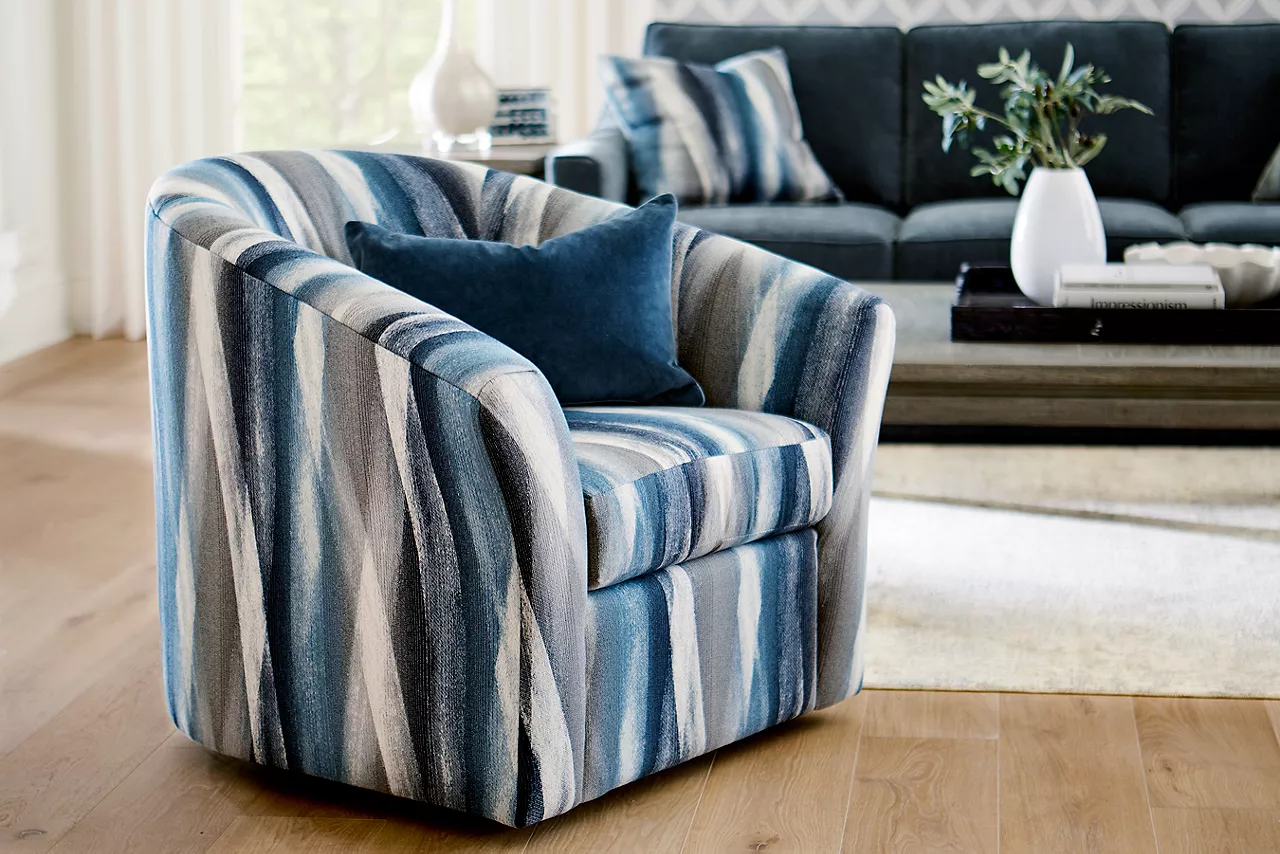 Shiloh sofa in Contessa Shadow and swivel accent chair in Zain Dusk in a room scene.