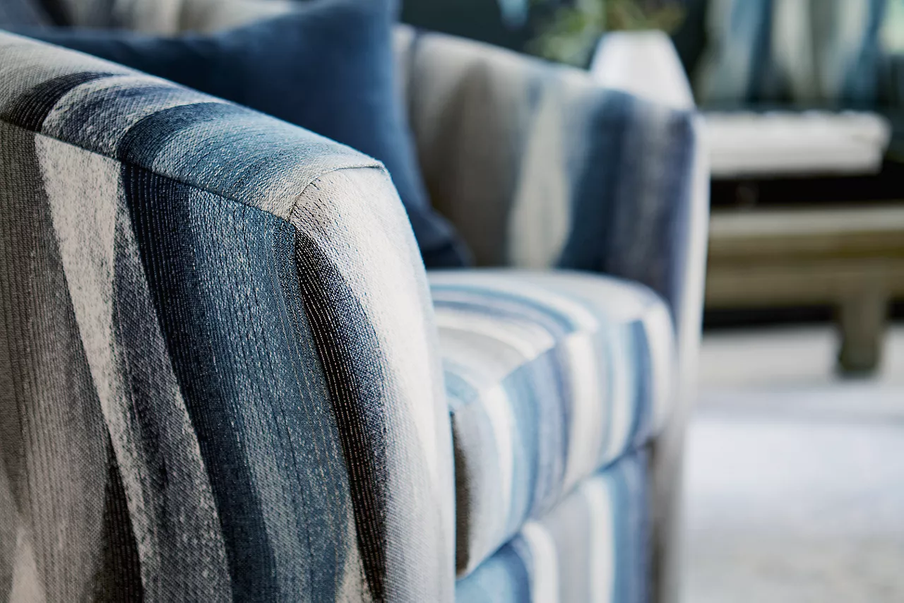 Closeup of the Shiloh Swivel Accent Chair in Zain Dusk in a room scene.