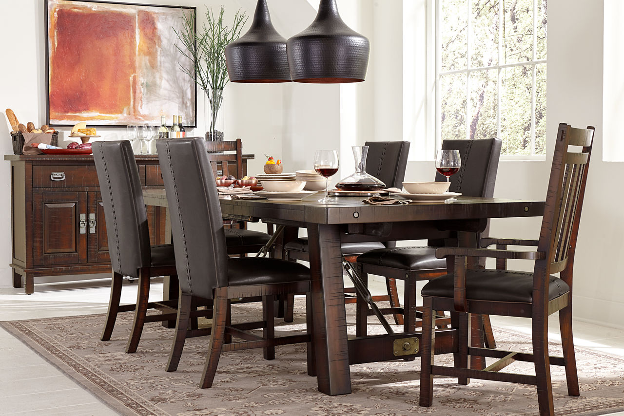 Arden Ridge Trestle Table, Armchairs, Parsons Chairs, and Buffet in Mahogany in a room scene.