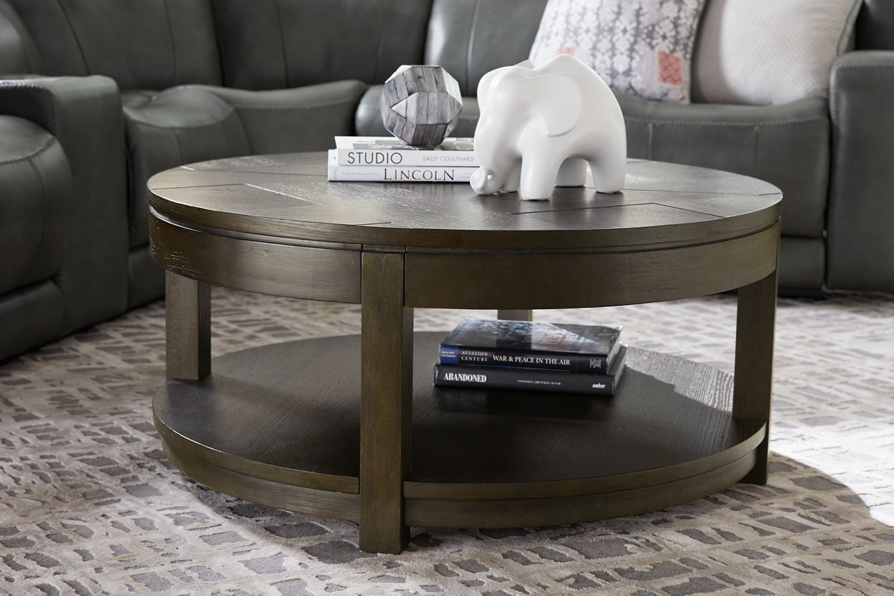 The Brody round storage coffee table in room scene.