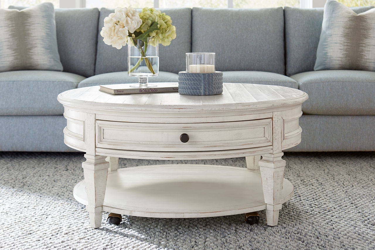 The Beckley round coffee table in Alabaster in room scene.