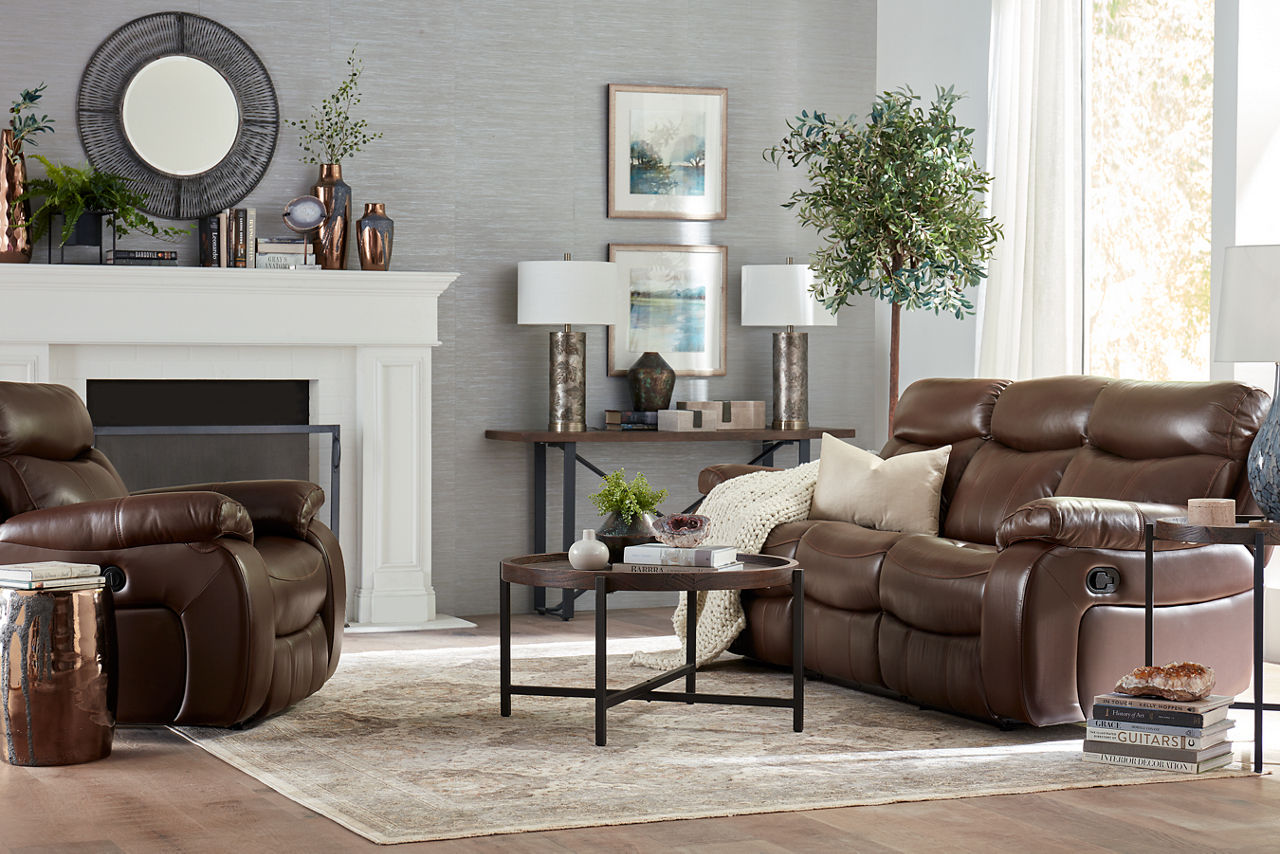 Wrangler sofa and recliner in Cognac with a Knox coffee, end, and console table in a room scene.
