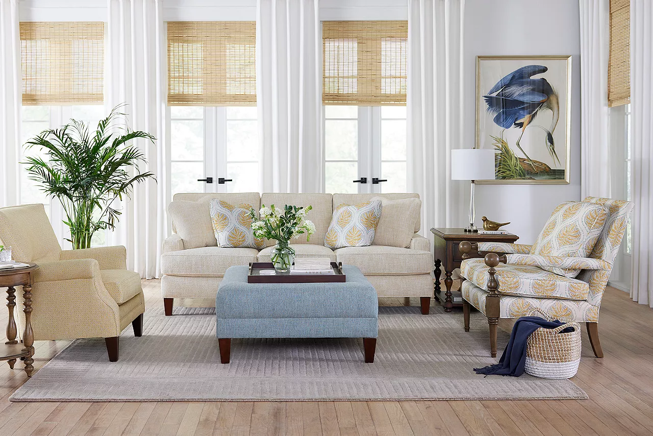 Elise sofa, wood accent chair, wingback accent chair and cocktail ottoman in a room scene