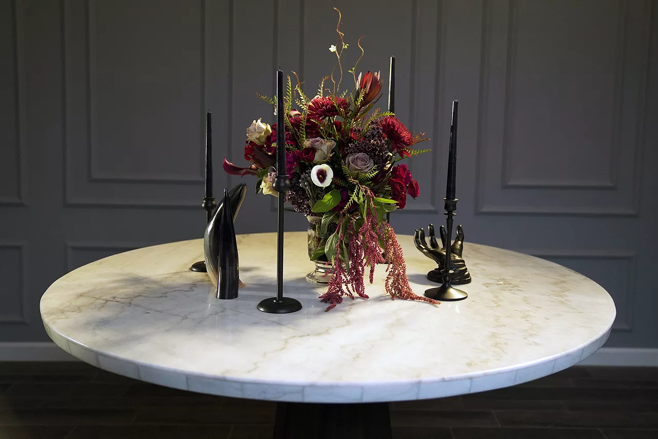 Image of floral center piece surrounded by candles
