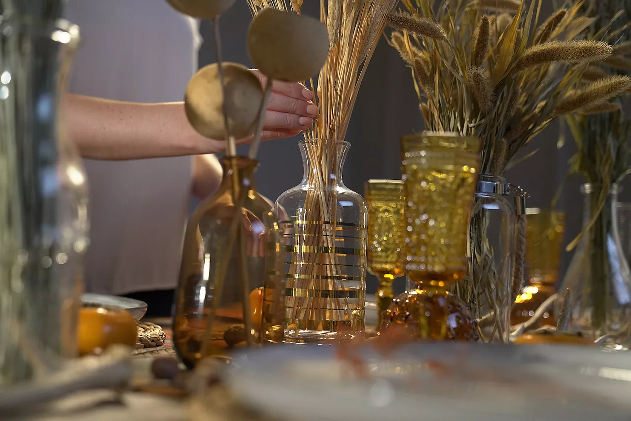 woman decorating dining room table