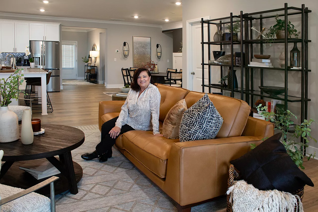 Homeowner in new living room by Havertys Free Design Service