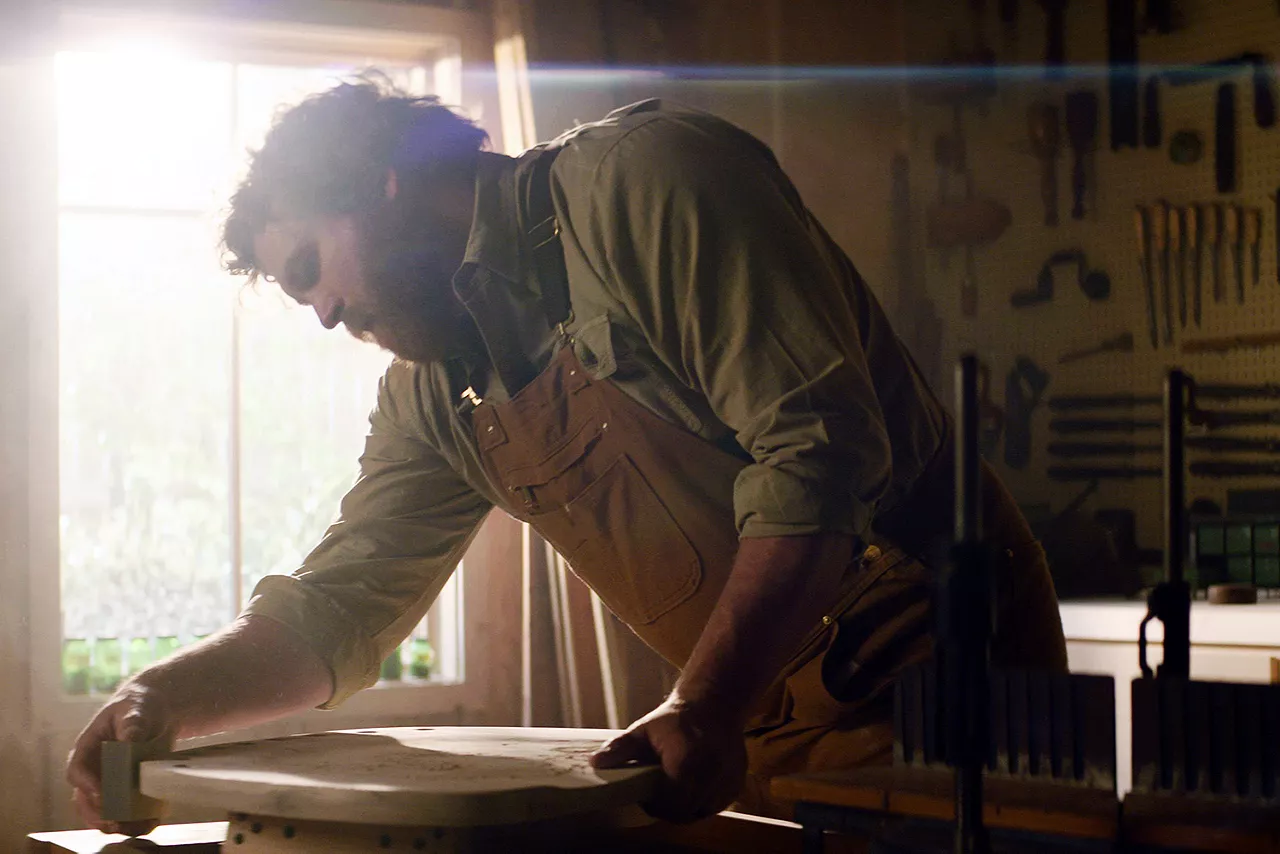 Image of carpenter working in his workshop