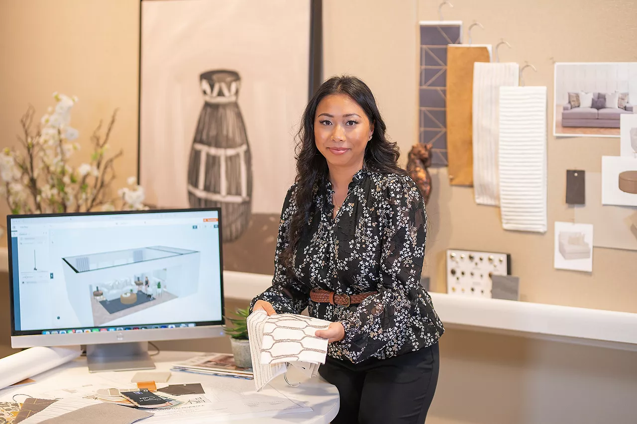Image showing a Havertys Designer holding fabric swatches