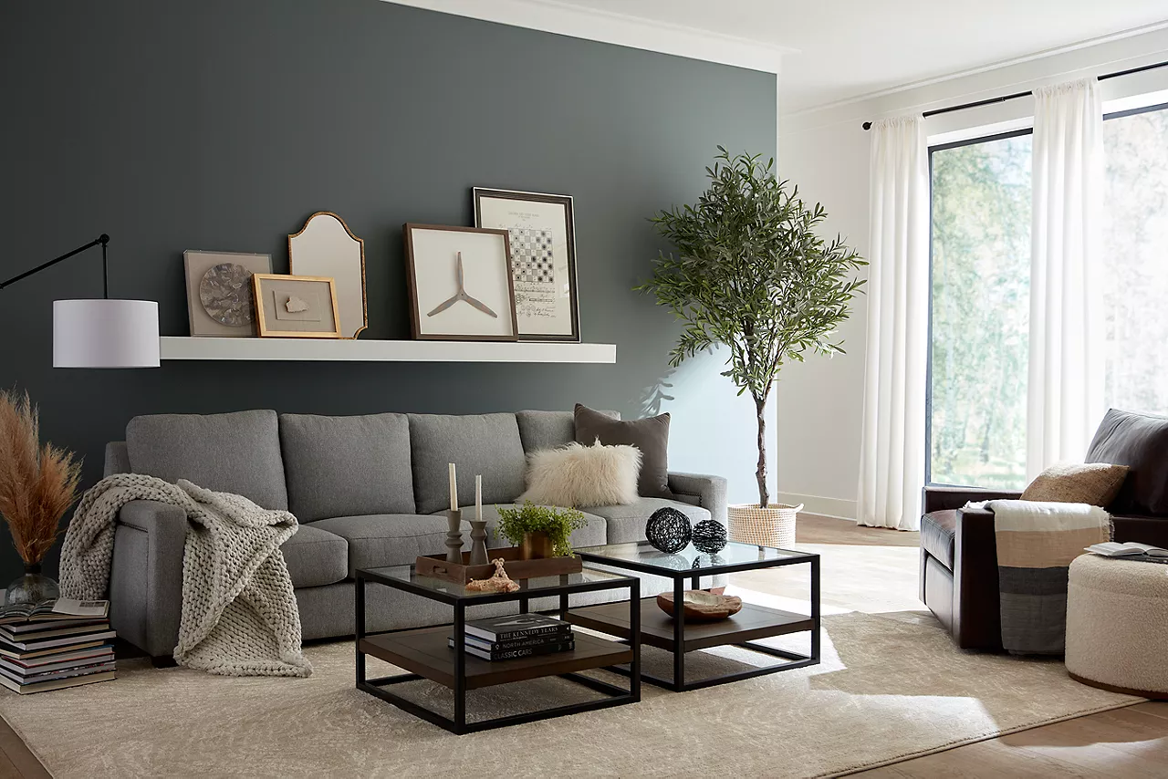 Variations sofa with wall art and Mason leather swivel chair