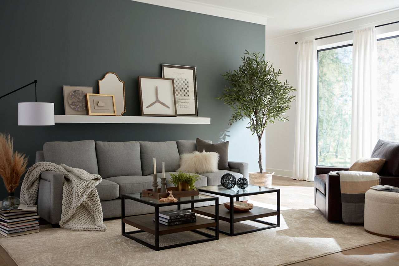 Variations sofa with wall art and Mason leather swivel chair